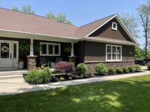 Clean edged beds and trimmed shrubs across the front of a home near Laingsburg